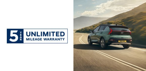 Car with branding for 5-year unlimited mileage warranty driving on a winding road.