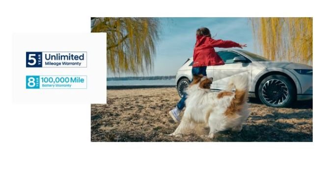 Child playing with a dog near a parked car; warranty information displayed on the left.